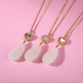 wholesale Metal material: 925 silver gold plated Petite and unique design, girlfriend's gift necklace featuring a heart-shaped mother-of-pearl drop and Hetian jade pendant-0-3