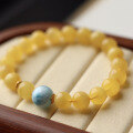 wholesale A metal natural honey amber and sea sediment stone bracelet with white flower chicken oil yellow, paired with a full-back tortoise-patterned sea sediment stone chain, looks elegant on the wrist-0-1