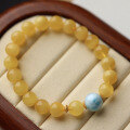 wholesale A metal natural honey amber and sea sediment stone bracelet with white flower chicken oil yellow, paired with a full-back tortoise-patterned sea sediment stone chain, looks elegant on the wrist-0-5
