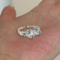 wholesale S925 Sterling Silver Silver Sea Blue Star Small Personality Design Irregular Crinkle Texture Sea Blue Zircon Open Adjustable Ring for Women-Silver Adjustable opening