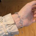 wholesale 925 Sterling Silver Small Fresh Clover Hollowed-out with Marble Eye Stone High-end Feeling Bracelet for Women-0-0