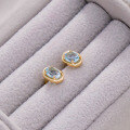 wholesale S925 silver plated with 14k gold, Dunli Jewelry manufacturer wholesale French sky blue topaz ear studs-0-5