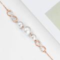 wholesale 10k Rose Gold Infinity Pearl Bracelet With White Pearls And Diamonds-0-3
