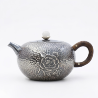 wholesale Pure 999 Elegant Hammered Silver Teapot with Exquisite Floral Relief and Wooden Handle - Handicraft-undefined