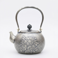 wholesale Pure 999 Fine Silver Hand-Hammered Silver Teapot Featuring Intricate Peony Floral Carvings and Elegant Arched Handle - Handicraft-undefined