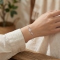 wholesale 925 Sterling Silver Elegant Silver Bracelet Featuring Pink Enamel Flowers and a White Jade Donut Center. - JewelryODM-0-1