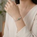 wholesale 925 Sterling Silver Elegant S925 Sterling Silver Bracelet with Green Jade Ring and White Floral Charms - JewelryODM-0-1