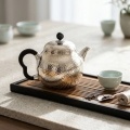wholesale 999 Pure Silver Artisanal Hand-hammered Silver Teapot With Elegant Black Handle And Decorative Cloud Motif Knob - Handicraft-0-2
