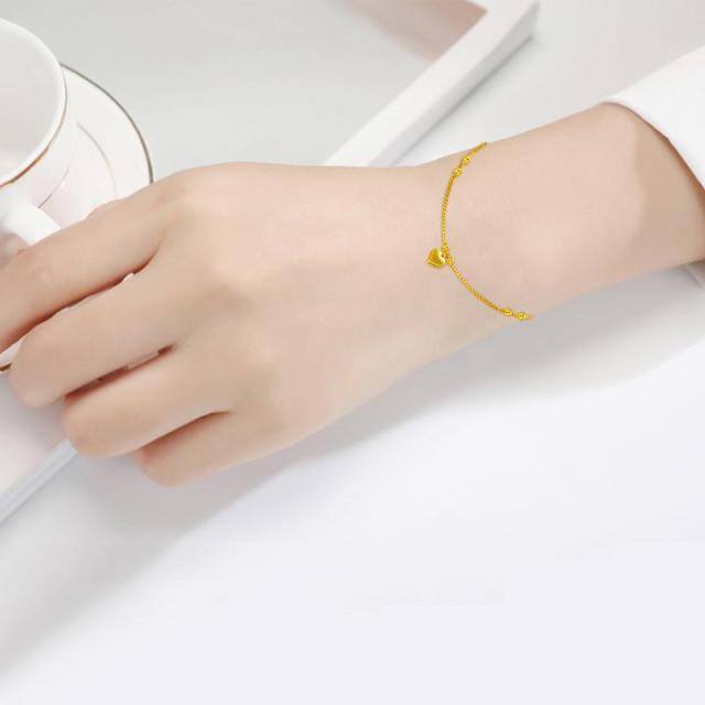 Bracelet en or 18K avec pendentif en forme de cœur et de perles-1