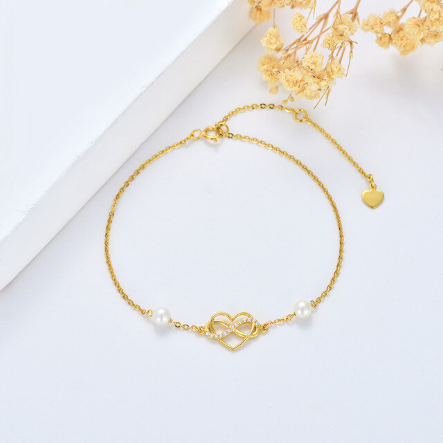 Pulsera de oro de 14 quilates de circonita cúbica y perla con colgante de corazón y símbol-2